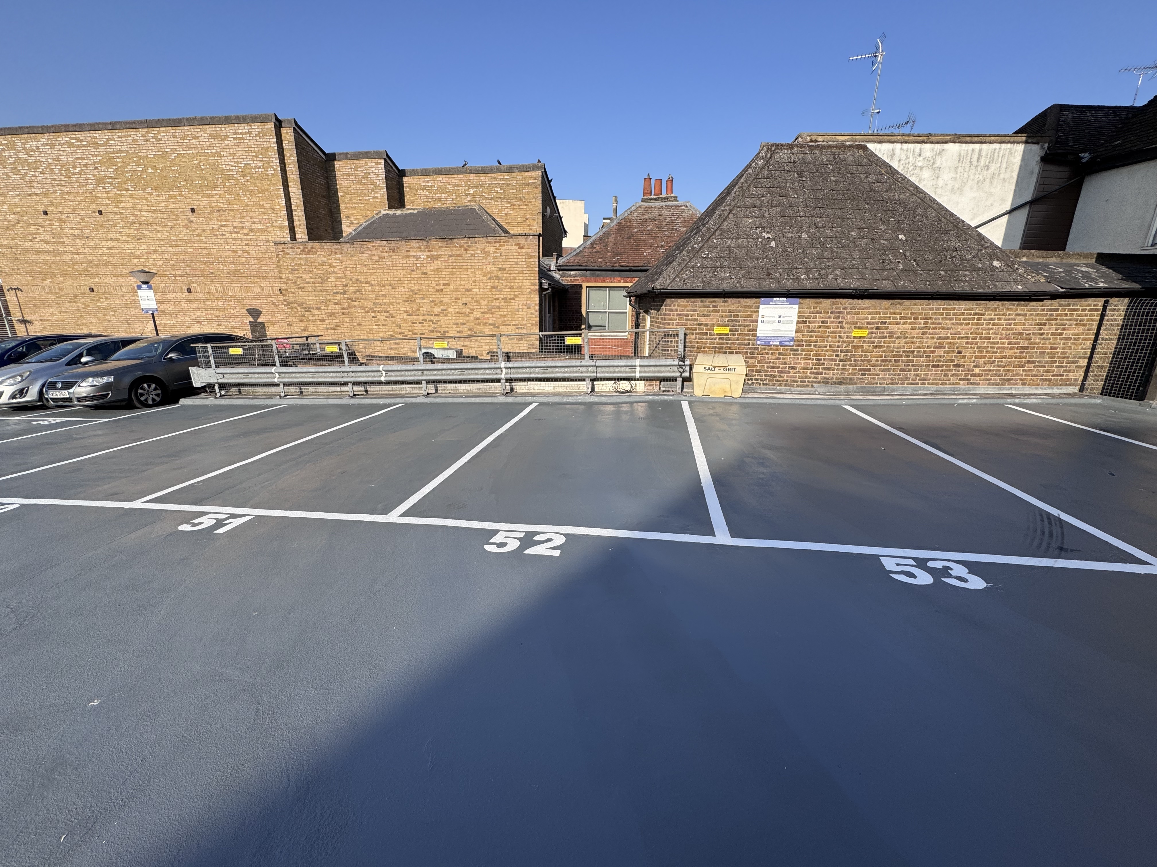 Freshly coated rooftop car park with numbered Acrylicon resin flooring bays