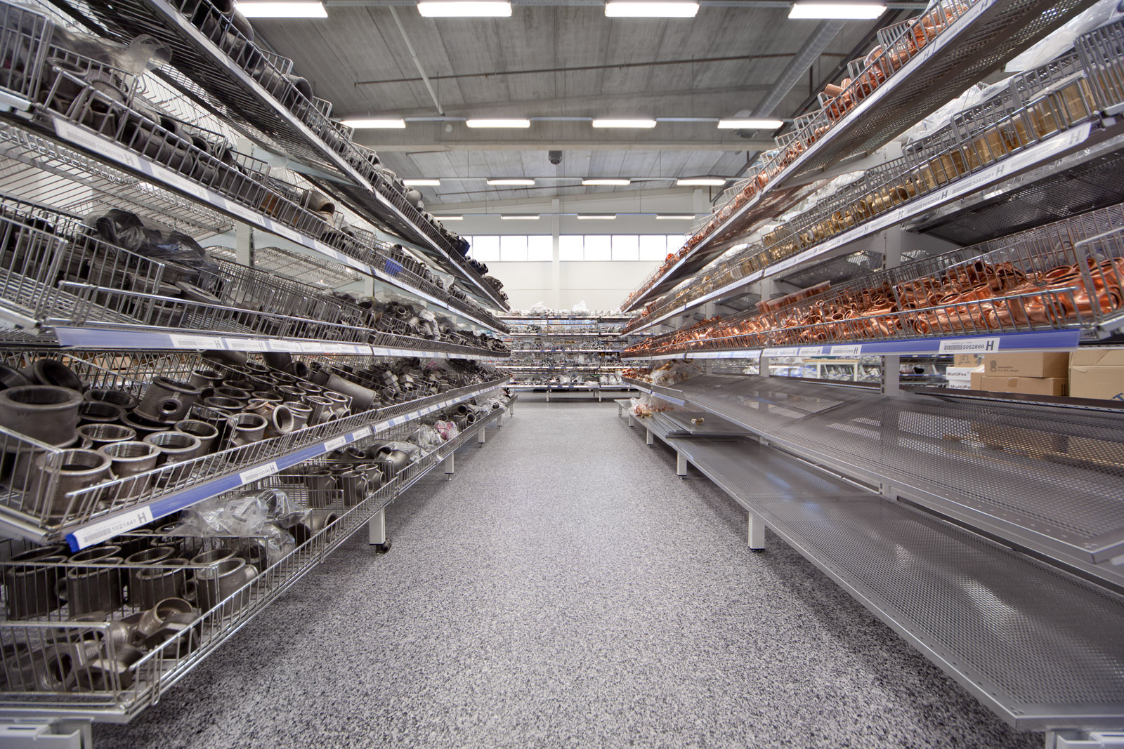 Acrylicon resin flooring in a retail warehouse aisle