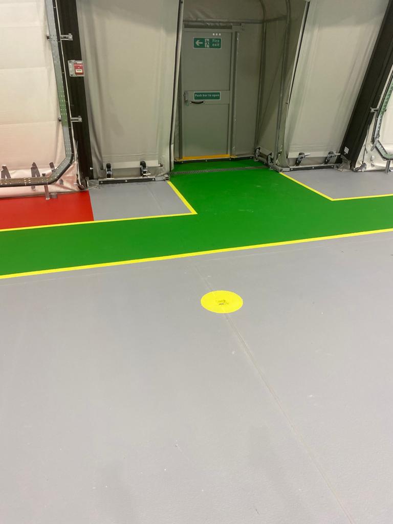 Completed ESD aircraft hangar floor with traffic markings